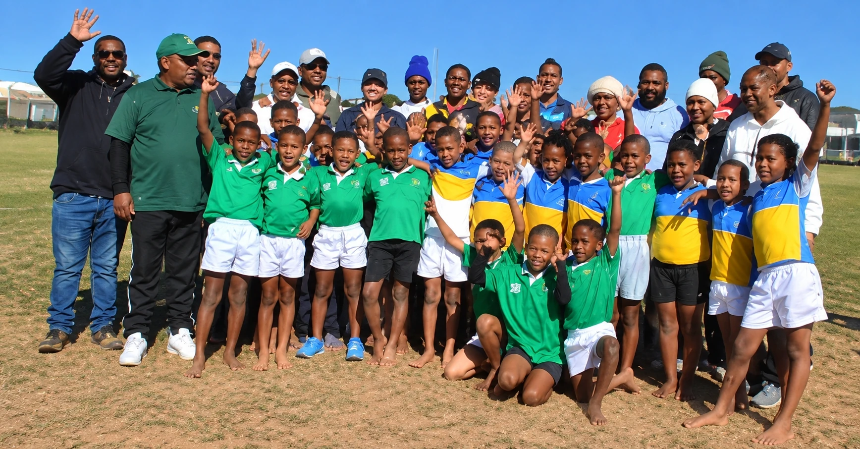 Our under-9 rugby champions celebrating with their coaches and supporters