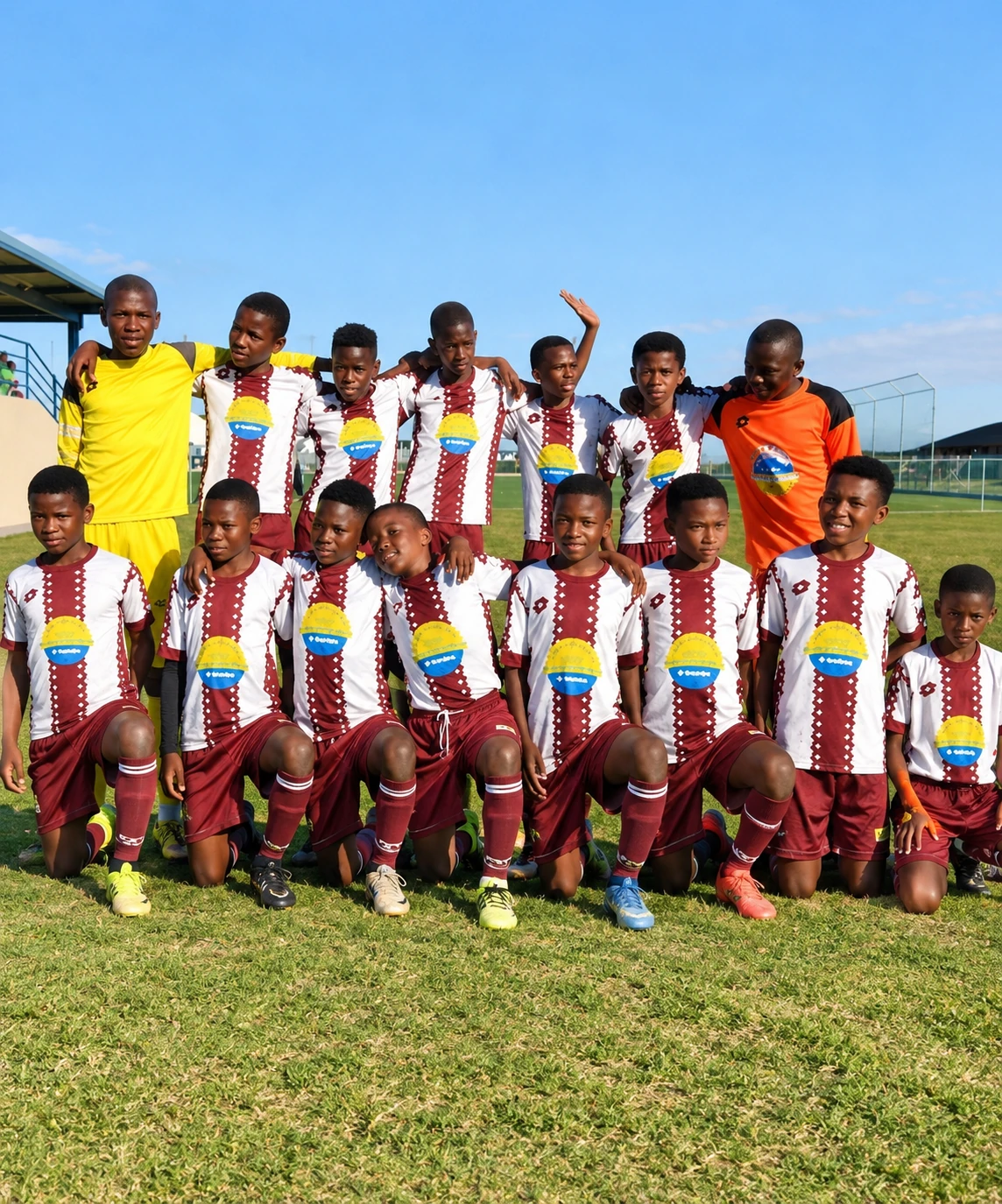 Our undefeated under-13 soccer team in their maroon-and-white kits